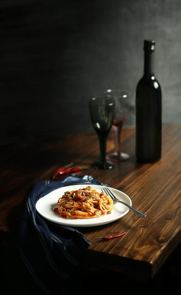 Pasta, lunch, dinner, wine, alcohol, spaghetti, tasty, table, Italian cuisine, dish — all the flavors you'd expect from a classic Italian restaurant in Kochi. Pasta, pasta, pasta, pasta, pasta, dinner, dinner, dinner, wine, wine, wine, wine, spaghetti.